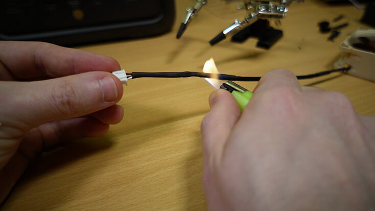 Insulating the modified fan cable with heat shrink tubing